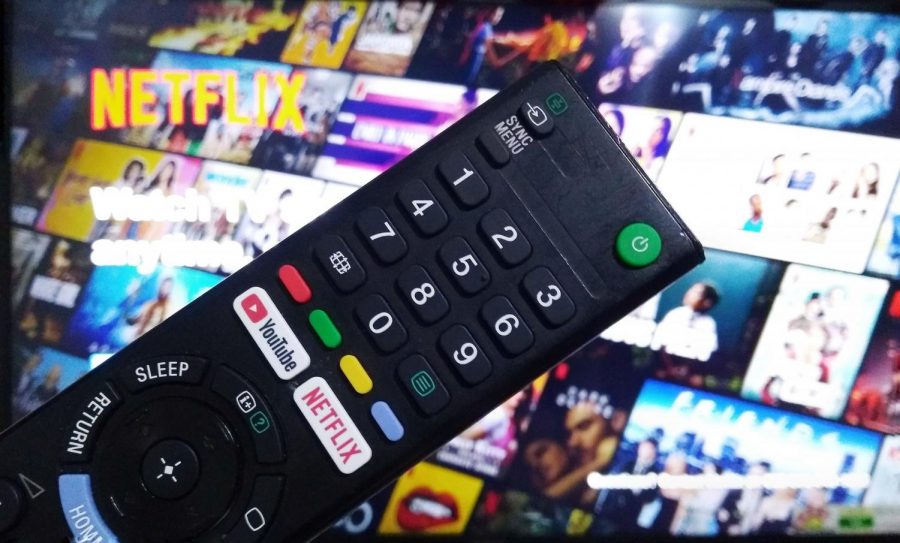 Remote in front of list of streaming shows.