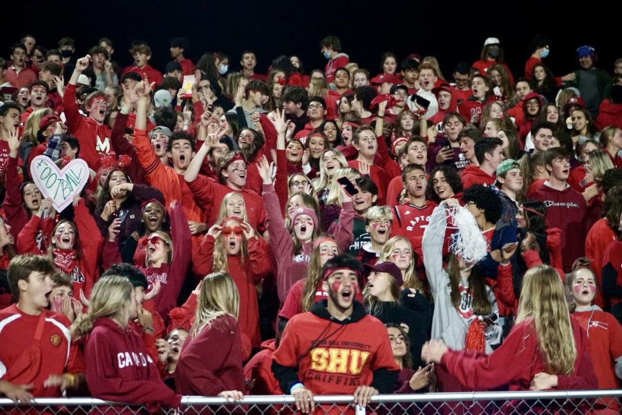 FM student fans cheer on the football team, mostly dressed in red for the schools Red Out event.