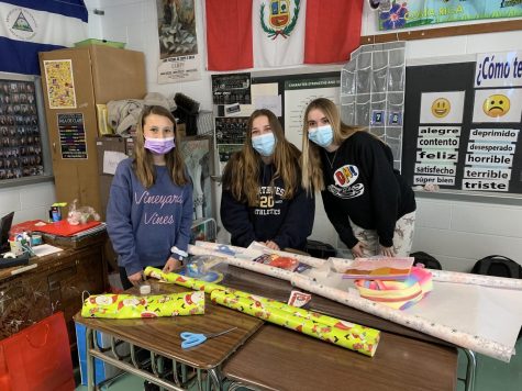 Spanish Club members wrap donated gifts.