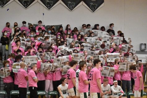 Pink Out fans held up copies of The Buzz while the opposing team was introduced.