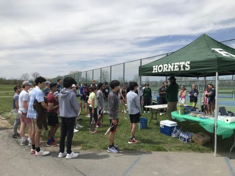 Tennis players line up outside the tent
