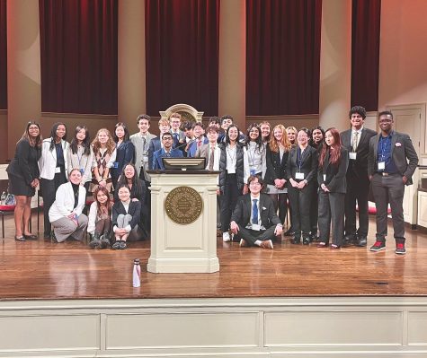 The FM participants pose on stage at Syracuse University.