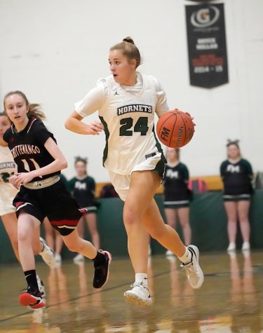 Lauren Hoffman dribbles up the court against the press.