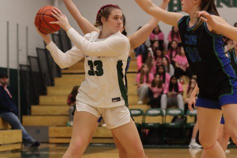 Madison Kirkpatrick secures a rebound and looks to outlet to a teammate.