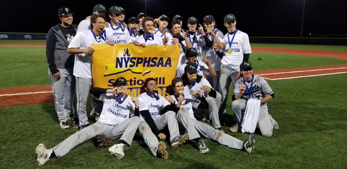 FM baseball players hold up the Section III champions sign after winning the title.