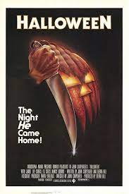 The movie poster displays a distorted pumpkin face with a dagger help up next to the face.