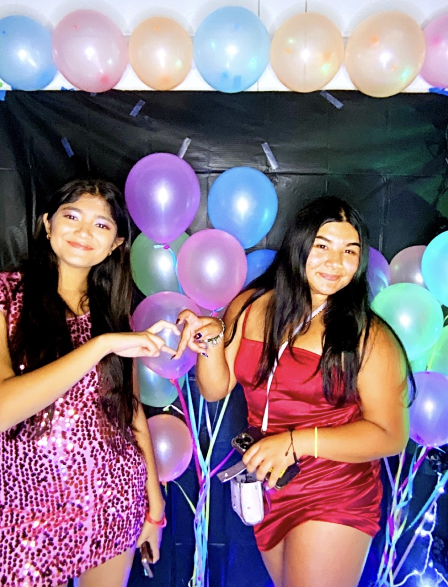 Students pose in the photo booth.