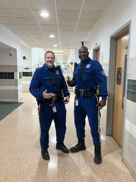 Officer Damon and Golden wear blue Paw Patrol police pajamas for the spirit day.