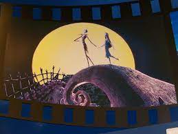 The two main characters of the story stroll on a creepy bridge in the moonlight.