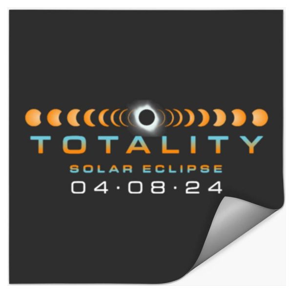 A black sticker with orange and blue lettering advertising the date of the eclipse.