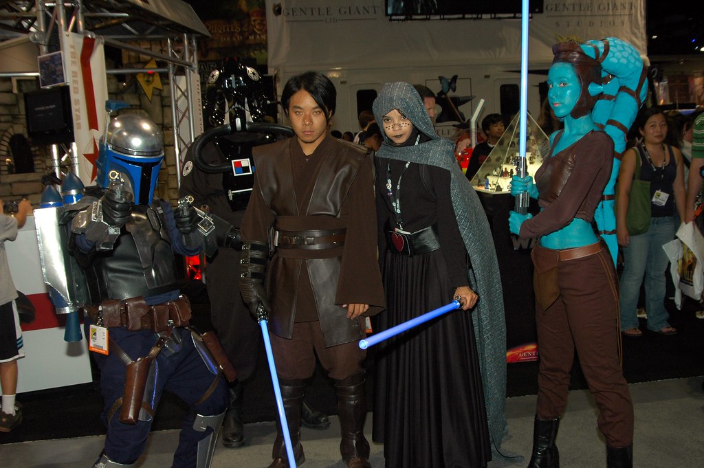 People dressed up as various Star Wars world characters for a cosplay event.