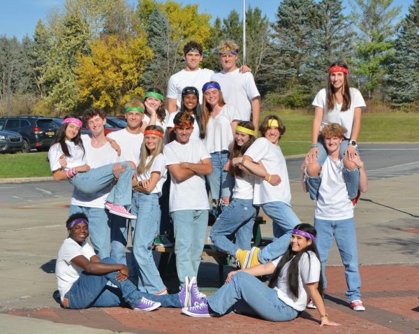 The new MC's pose as a group in jeans, white t-shirts and bandanas in their respective team colors.