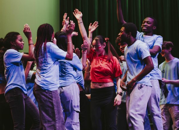 Performers participate in one of the dance numbers on stage