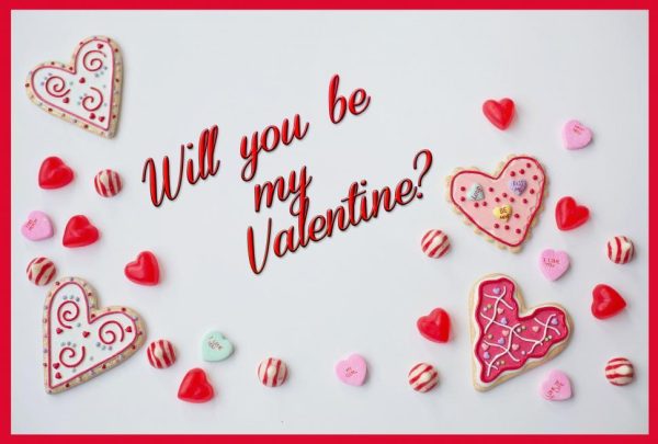 Various sized hearts that are candies and hearts are decorated in shades of red and pink. In the center is the caption, "Will you be my Valentine?