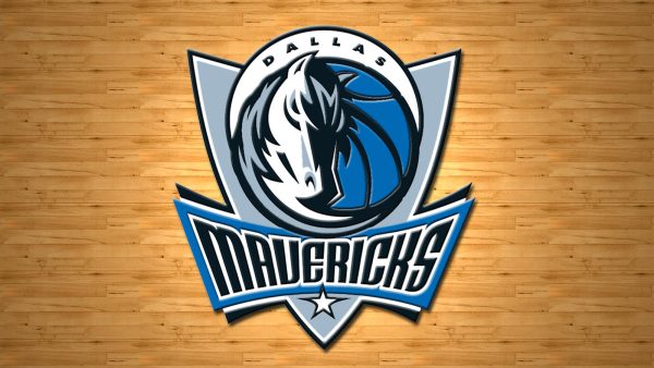 The Mavericks logo of a fierce looking white and gray stallion is blended in with a blue basketball with the team name underneath in black.