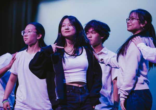 Dancers perform the routine for the K-pop number.