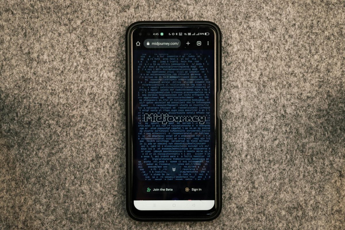 A cell phone against a tan and black textured background advertises Midjourney on the screen.
