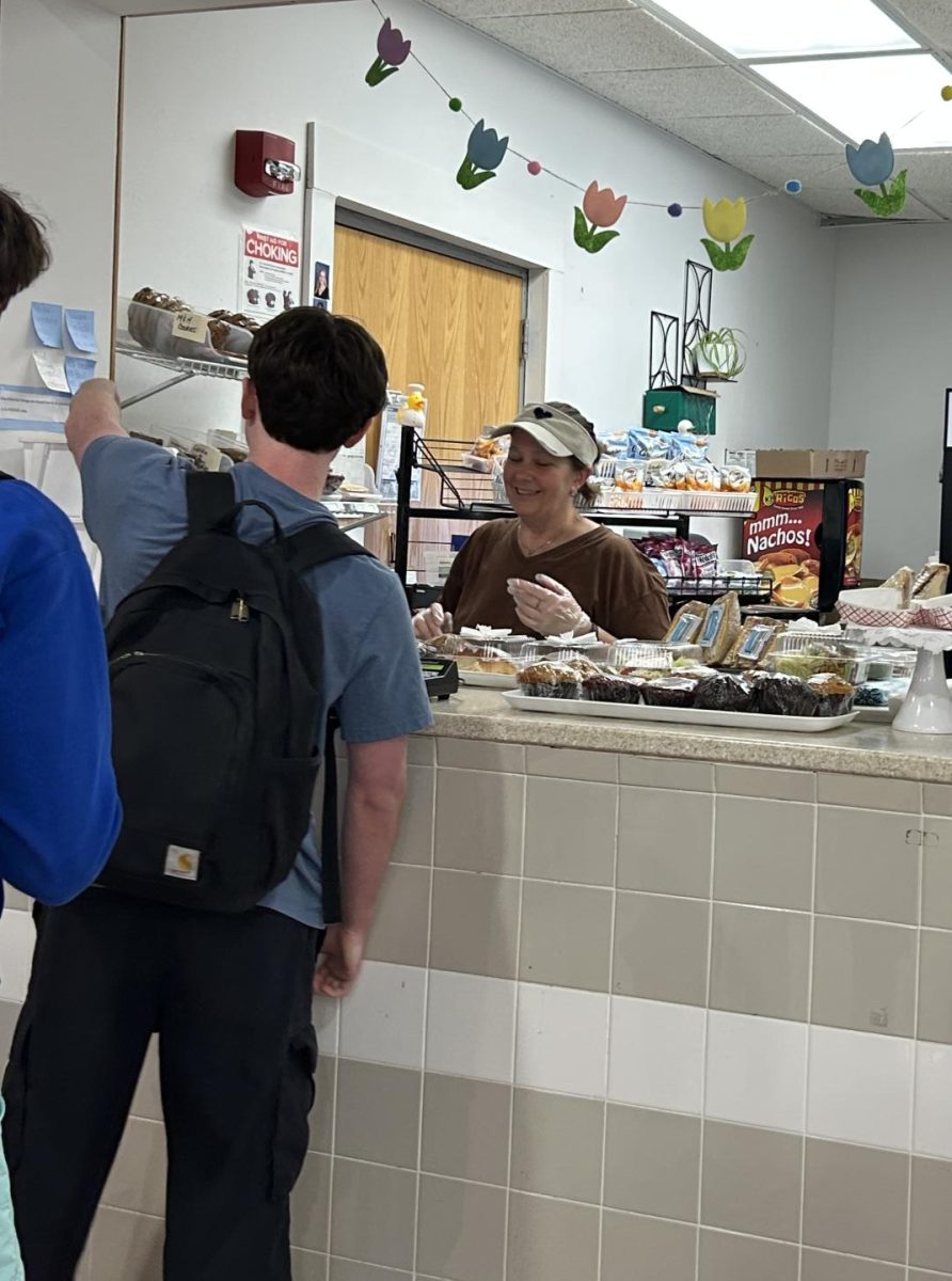 A student makes a selection at the House 1 snack shack