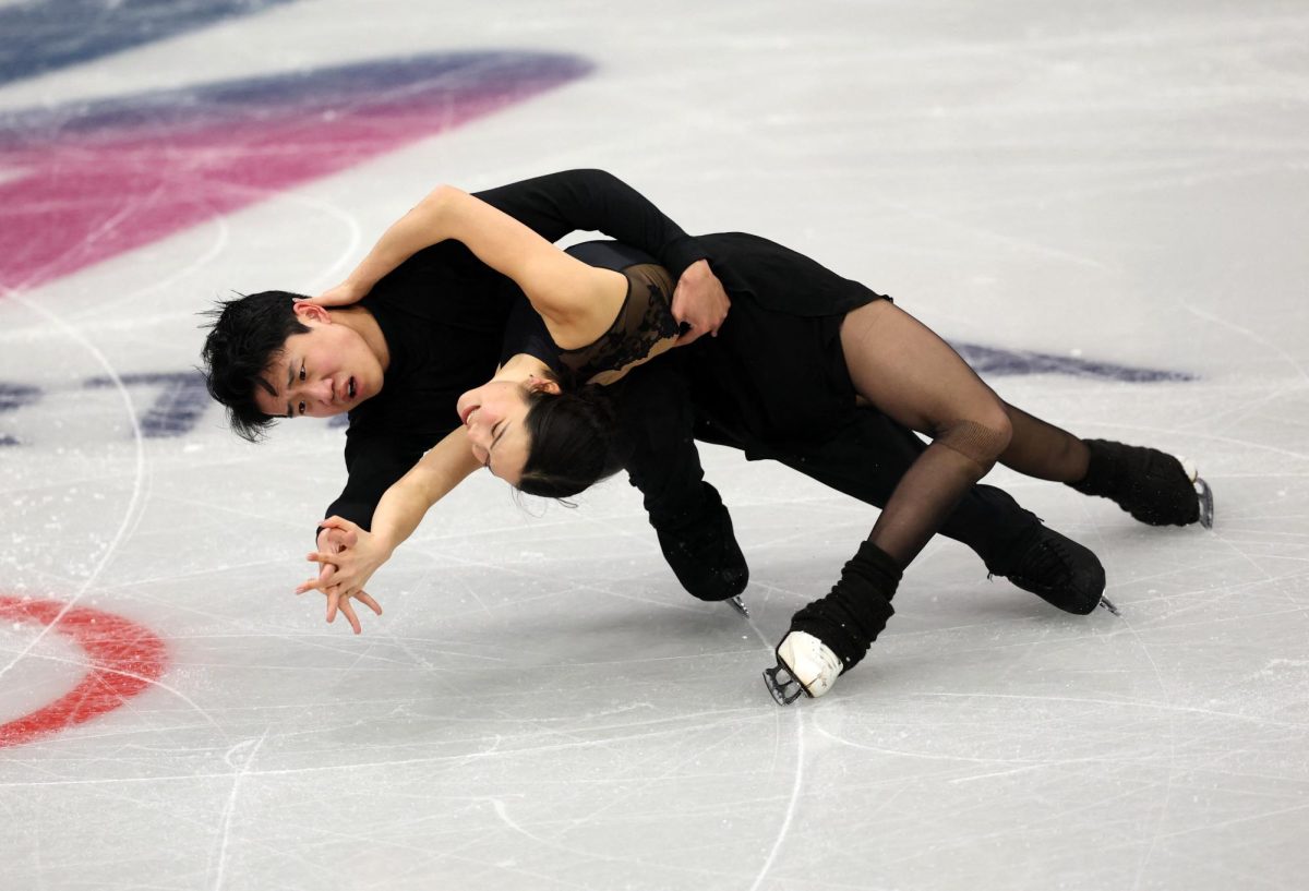 Paired figure skaters practice on the ice in the Milano Ice Skating Arena in Milan.